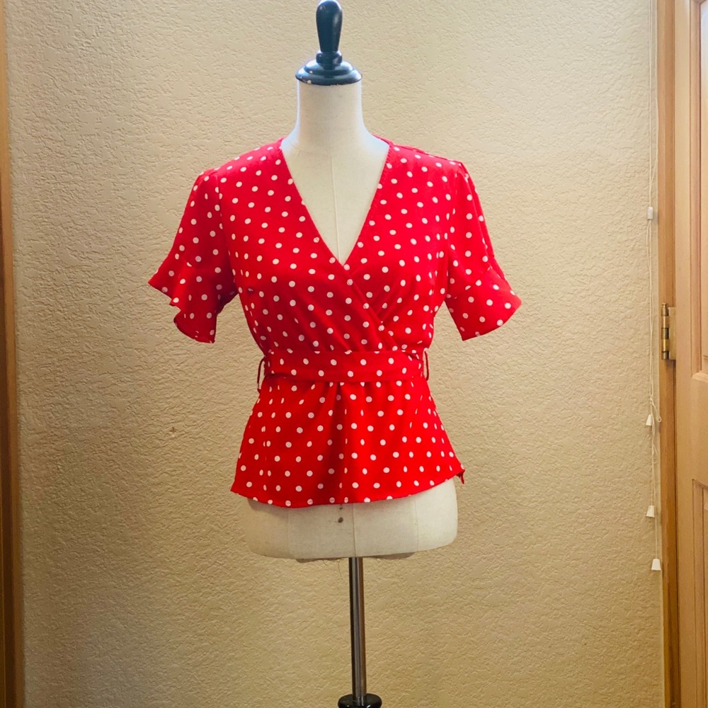Red and white polka dot blouse
